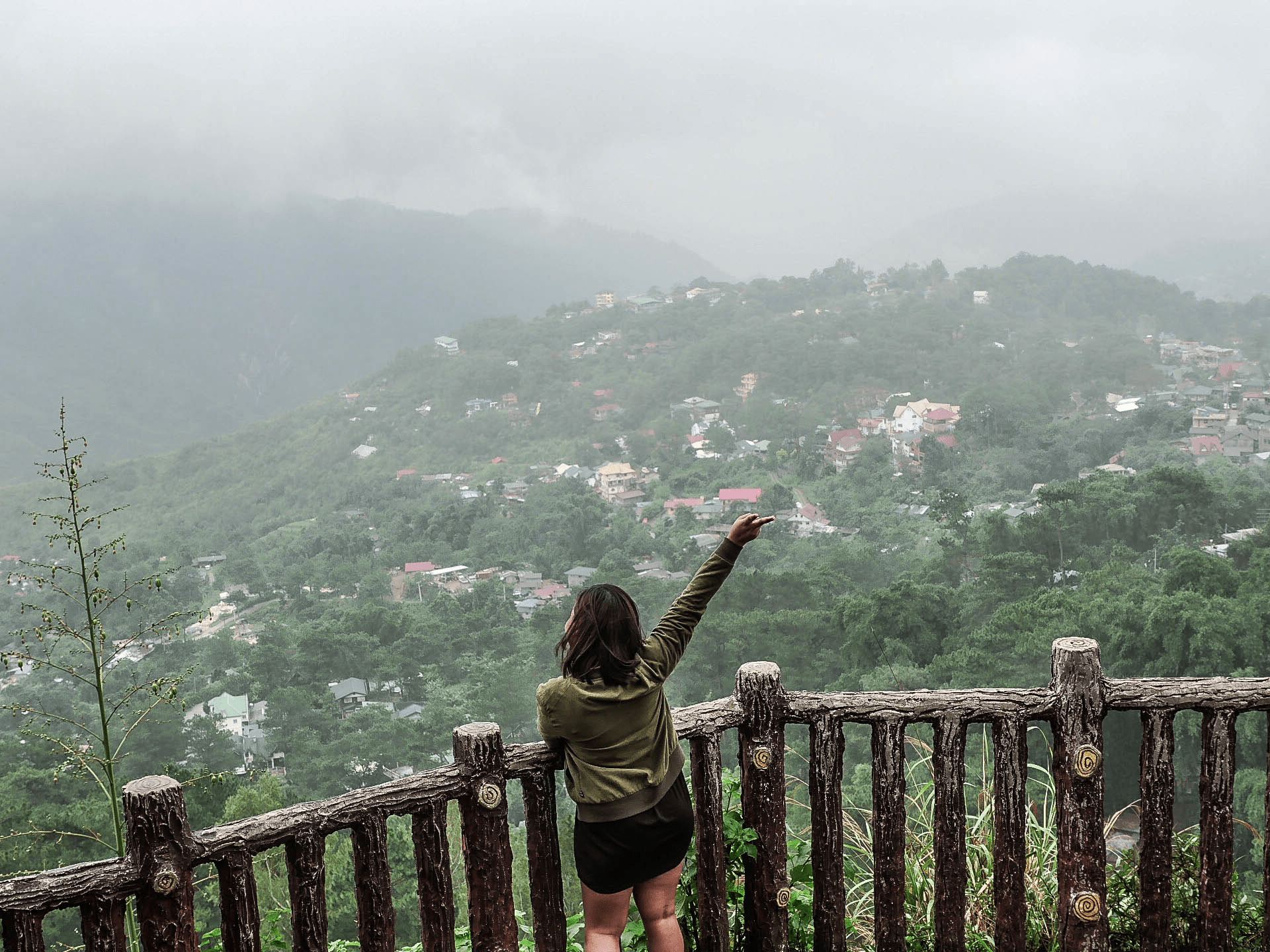 Melody somido filipina waving at valley Mines View Park baguio city philippines